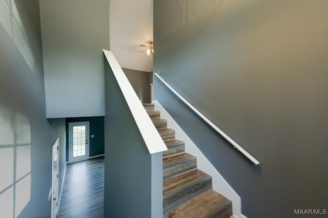 staircase featuring hardwood / wood-style flooring