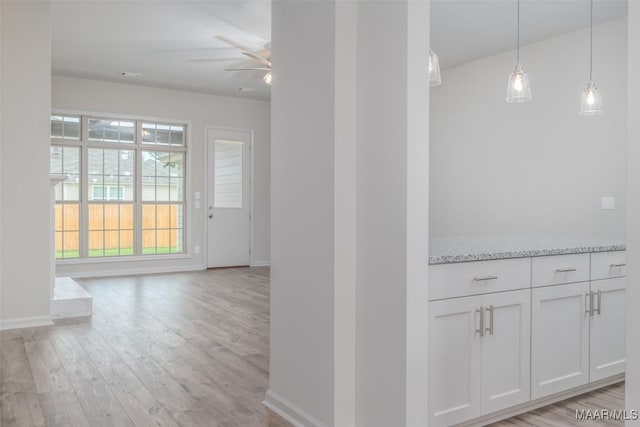 hall with light hardwood / wood-style flooring