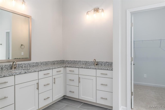 bathroom featuring tile patterned floors and vanity