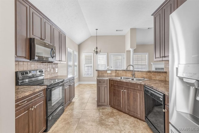 kitchen featuring black appliances, light tile patterned floors, sink, an inviting chandelier, and vaulted ceiling