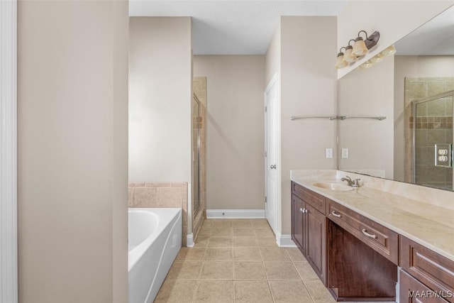 bathroom featuring vanity, tile patterned floors, and shower with separate bathtub