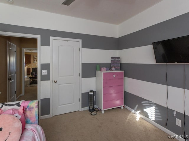 bedroom with ceiling fan and carpet