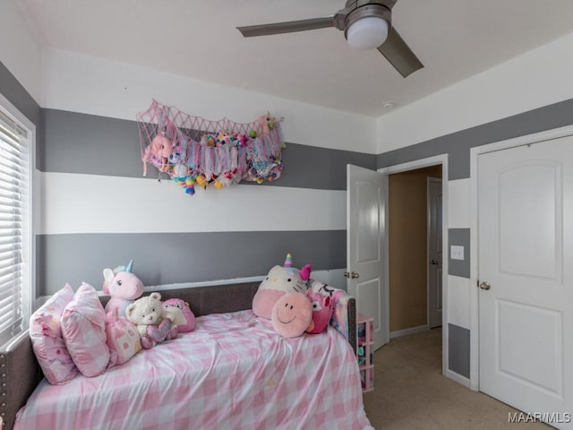 carpeted bedroom with ceiling fan