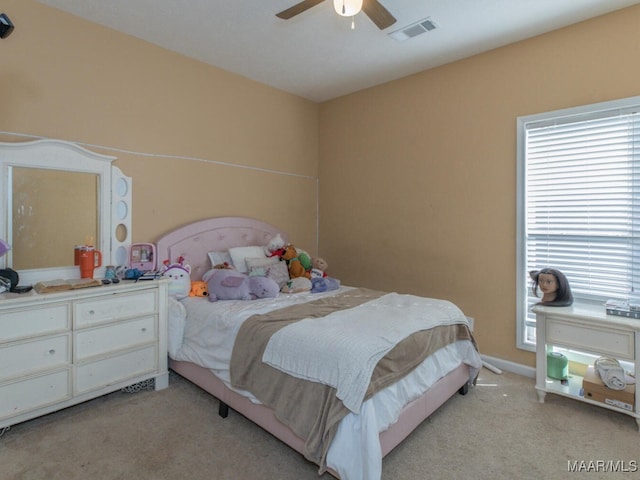 carpeted bedroom with ceiling fan