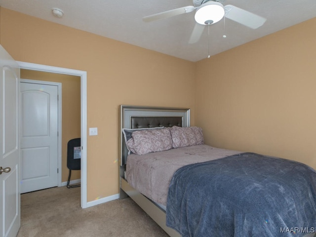 bedroom featuring ceiling fan and light colored carpet