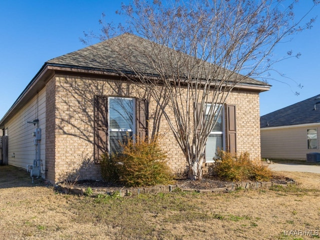 view of property exterior featuring a lawn