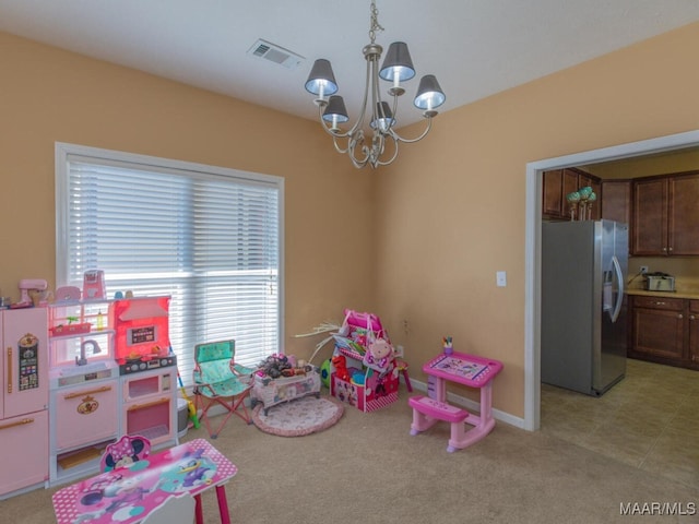 game room with light carpet and an inviting chandelier