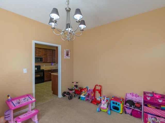 recreation room featuring light colored carpet and a notable chandelier