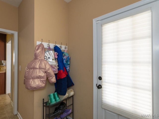 entryway featuring light tile patterned floors