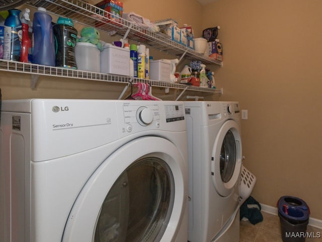 laundry area featuring separate washer and dryer and tile patterned flooring