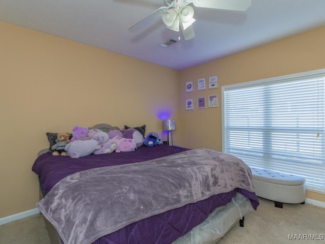 carpeted bedroom featuring ceiling fan