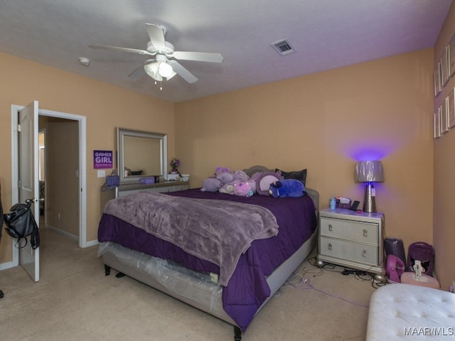 carpeted bedroom with ceiling fan