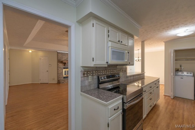 kitchen with white cabinetry, stainless steel electric range, a textured ceiling, washer / clothes dryer, and backsplash