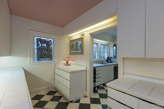 bathroom with wine cooler and sink