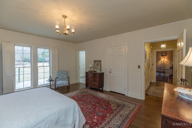 bedroom featuring dark hardwood / wood-style flooring and a notable chandelier