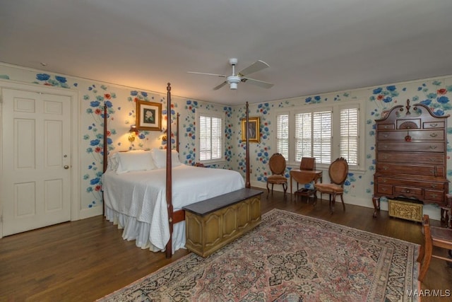 bedroom with dark hardwood / wood-style floors and ceiling fan