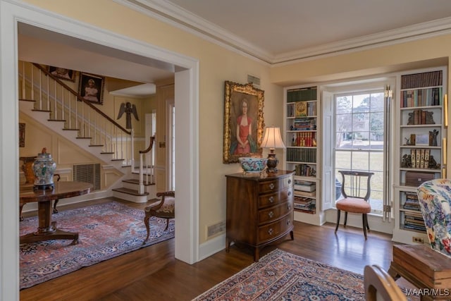 sitting room featuring ornamental molding, dark hardwood / wood-style floors, and built in features