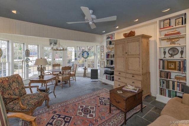 living room featuring french doors and ceiling fan