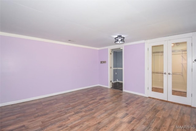 unfurnished bedroom with dark wood-type flooring and french doors