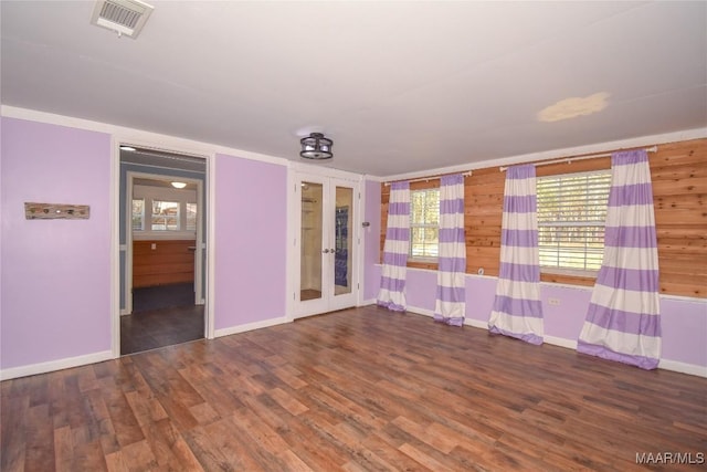 unfurnished room featuring hardwood / wood-style floors and french doors