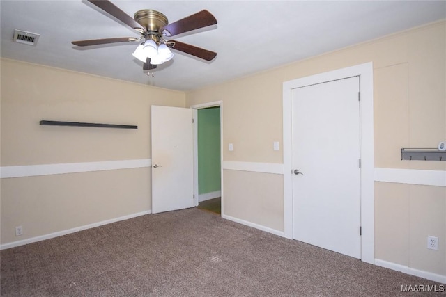 unfurnished bedroom with ceiling fan and carpet flooring