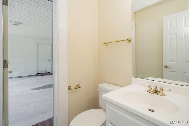 bathroom with vanity and toilet