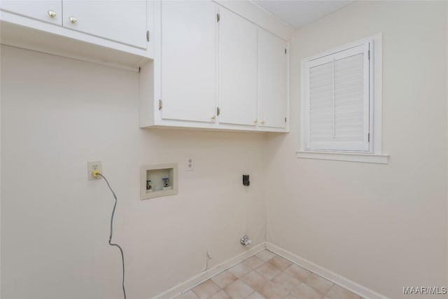 washroom featuring cabinets, washer hookup, and electric dryer hookup