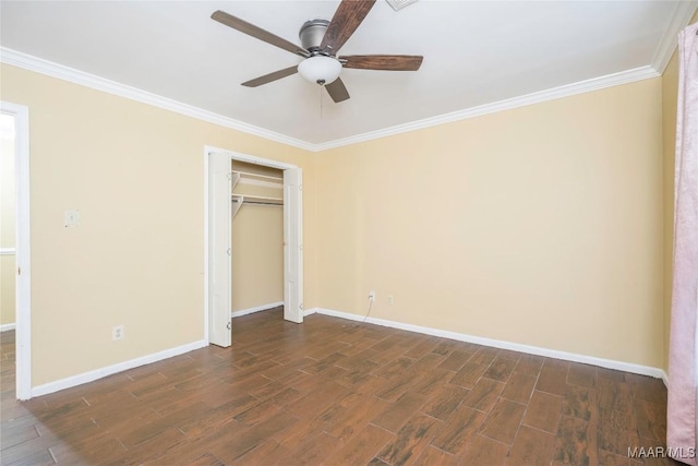 unfurnished bedroom with crown molding, ceiling fan, and a closet