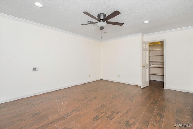 spare room featuring crown molding, ceiling fan, and a textured ceiling