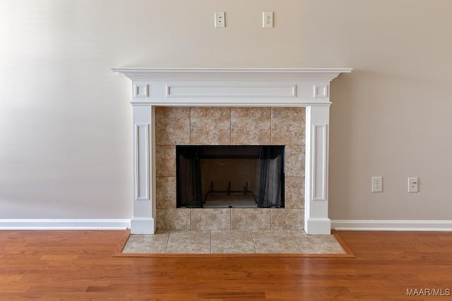 room details featuring hardwood / wood-style flooring and a fireplace