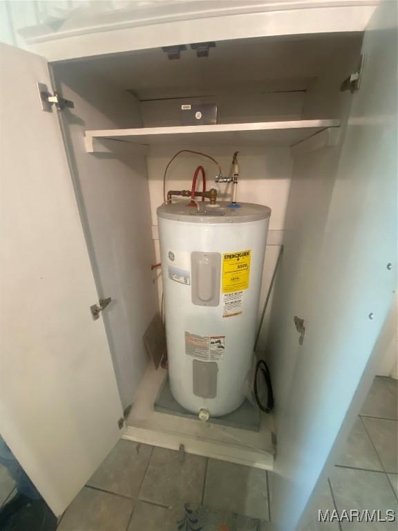 utility room featuring water heater