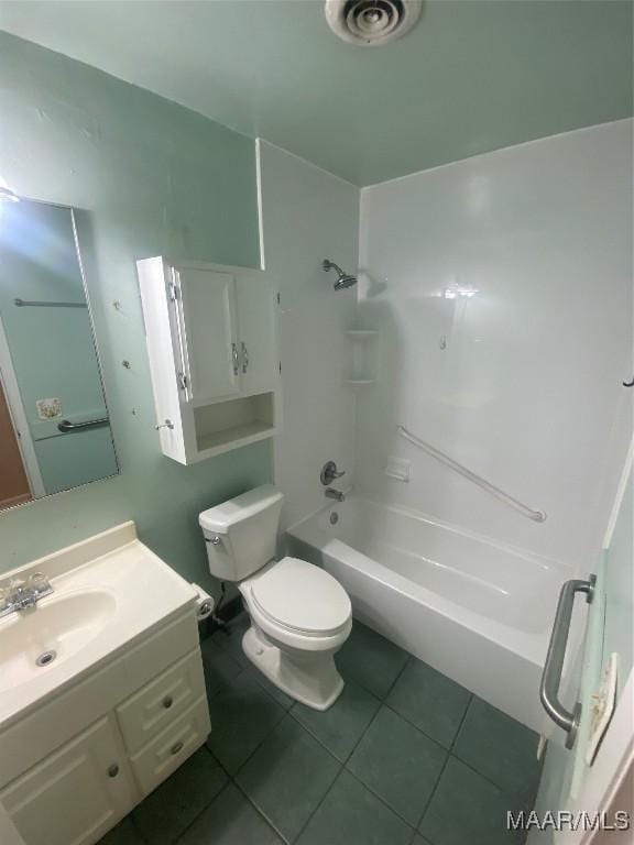 full bathroom featuring vanity, toilet, bathing tub / shower combination, and tile patterned flooring