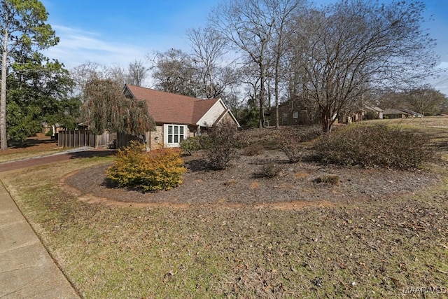 view of home's exterior with a lawn