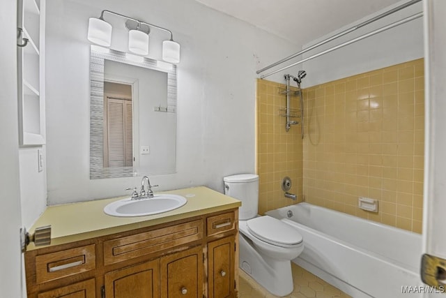 full bathroom with tiled shower / bath combo, vanity, and toilet