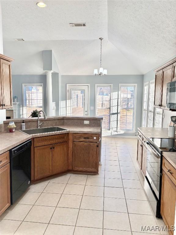 kitchen featuring lofted ceiling, black dishwasher, sink, light tile patterned floors, and electric range