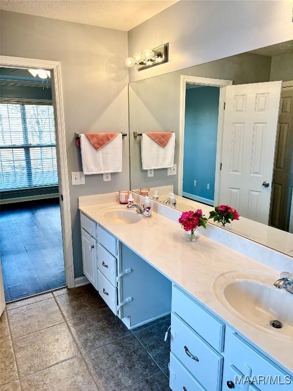 bathroom featuring vanity and a textured ceiling