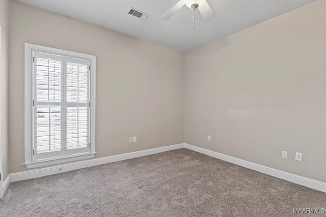 unfurnished room with light carpet and ceiling fan