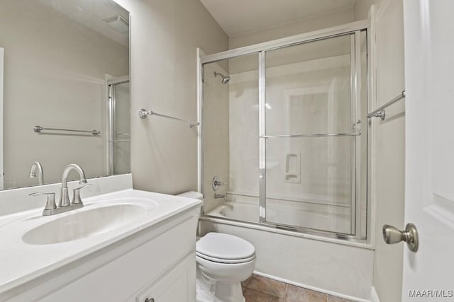 full bathroom with vanity, toilet, and combined bath / shower with glass door