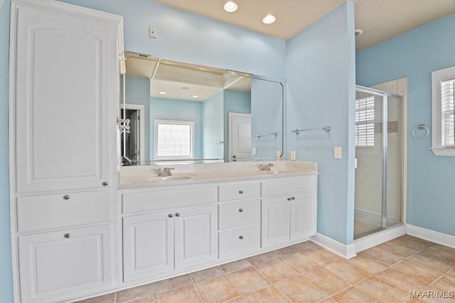 bathroom featuring vanity, an enclosed shower, and tile patterned flooring