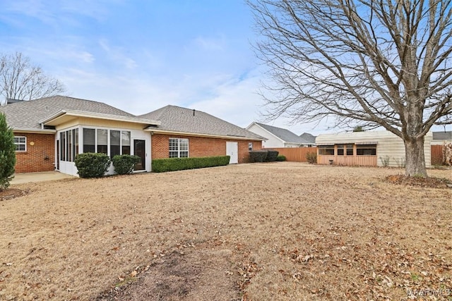 rear view of house with a sunroom