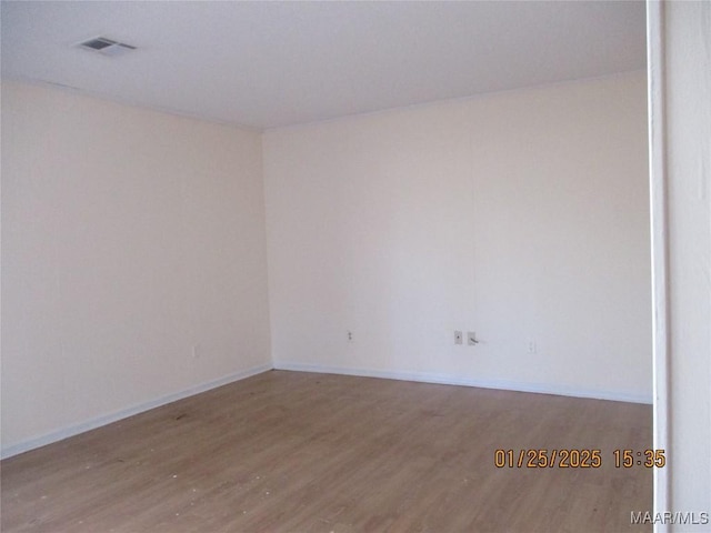 unfurnished room with light hardwood / wood-style floors