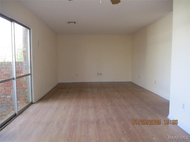 unfurnished room with ceiling fan and light hardwood / wood-style floors