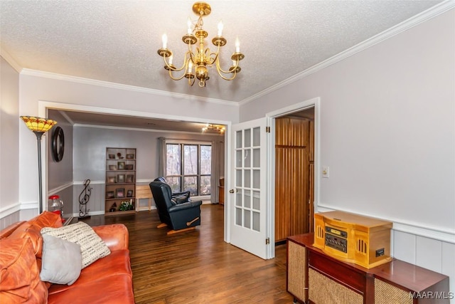 living room featuring crown molding, dark wood-type flooring, and a textured ceiling