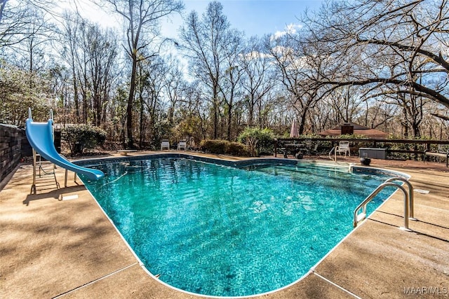 view of pool featuring a water slide