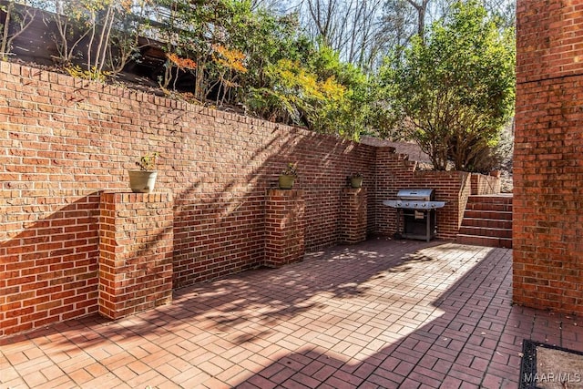 view of patio with a grill