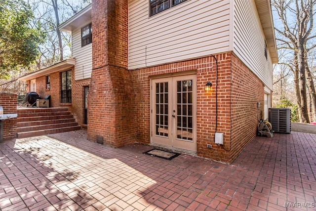 exterior space featuring cooling unit and french doors