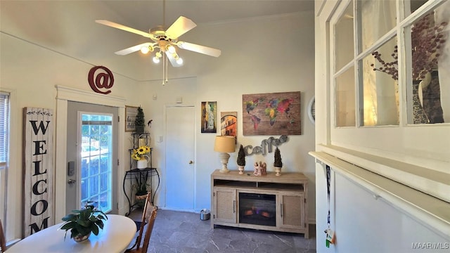 interior space featuring crown molding and ceiling fan