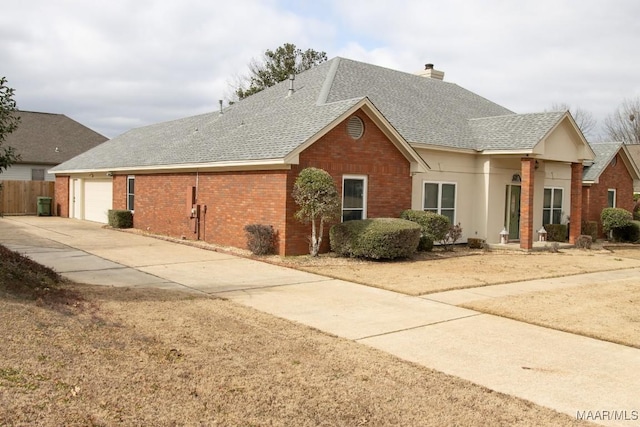 single story home featuring a garage