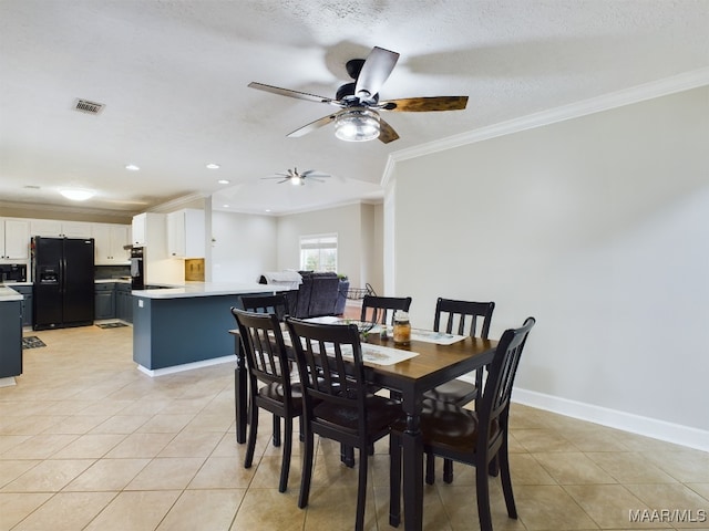 dining space featuring light tile patterned floors, baseboards, visible vents, and crown molding