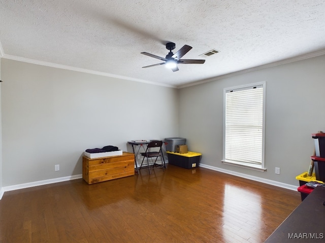 interior space featuring ornamental molding, dark wood-type flooring, visible vents, and baseboards